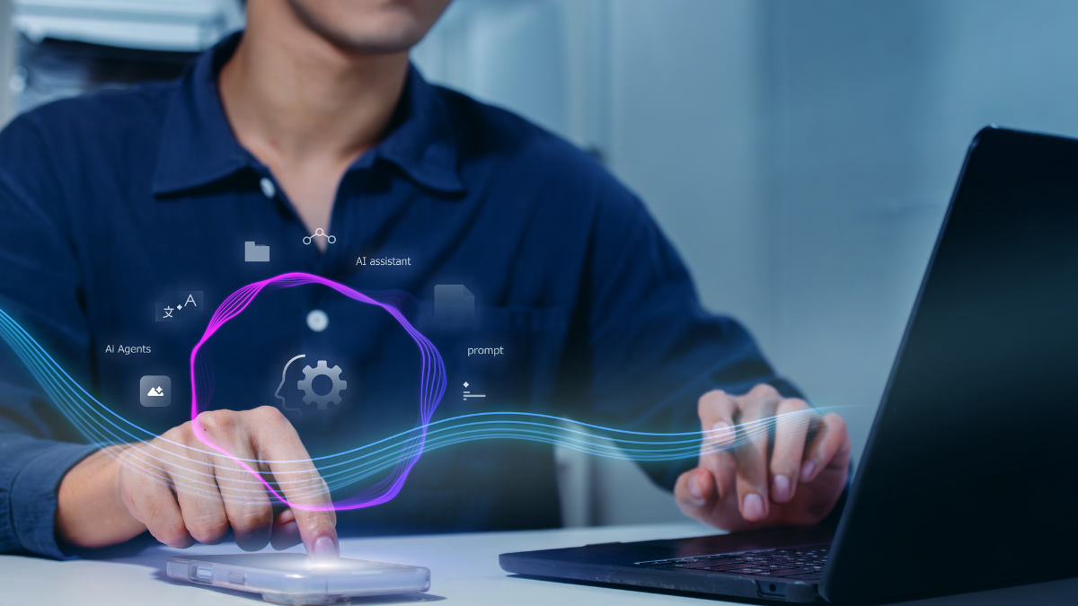 Professional using a smartphone and laptop with a virtual AI interface showing AI agents, prompts, and automation tools.